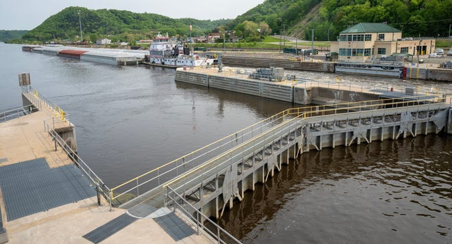 The tug Theresa L. Wood heads upstream after locking through Lock and Dam #8 Wednesday, May 17, 2023 in Genoa, Wis.  The vessel was moving barges from St. Louis to Winona, Minn. The locks allow the boats to gradually adjust to changing river levels. Most towboats can push 15 barges at a time on the river. When those barges reach a 600-foot long lock, they don’t fit. Instead, they have to be split up, which takes more than twice as long.It was constructed and was put into operation by April 1937.