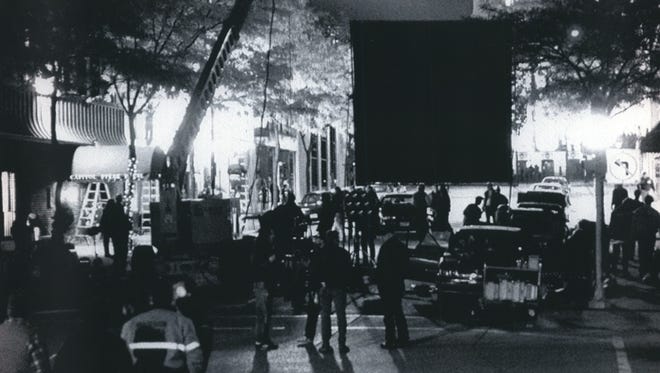 A film crew turns King St. in Madison into a movie set for the film "I Love Trouble" on Oct. 13, 1993. Onlookers crowded behind barricades to catch a glimpse of the movie's stars, Nick Nolte and Julia Roberts. Other scenes were filed in the State Capitol and areas near Madison.