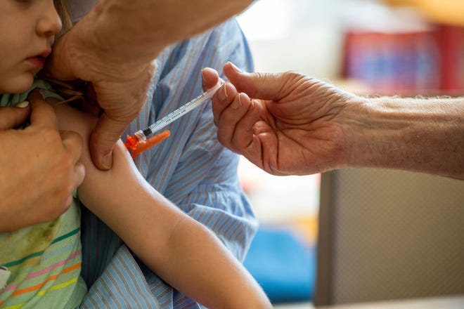 A young child receives a Moderna Covid-19 6 months to 5 years vaccination at Temple Beth Shalom in Needham, Massachusetts on June 21, 2022.