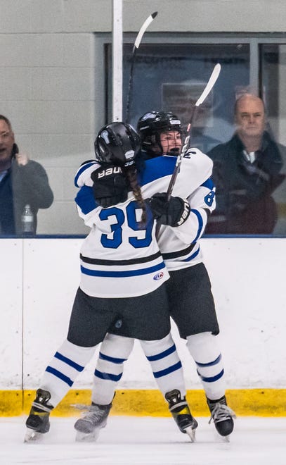 Lakeshore Lightning's Jillian Bilsborough (8) celebrates a goal against Arrowhead with teammate Cheyenne Mojica (39) at the Ozaukee Ice Center in Mequon on Wednesday, Nov. 29, 2023.