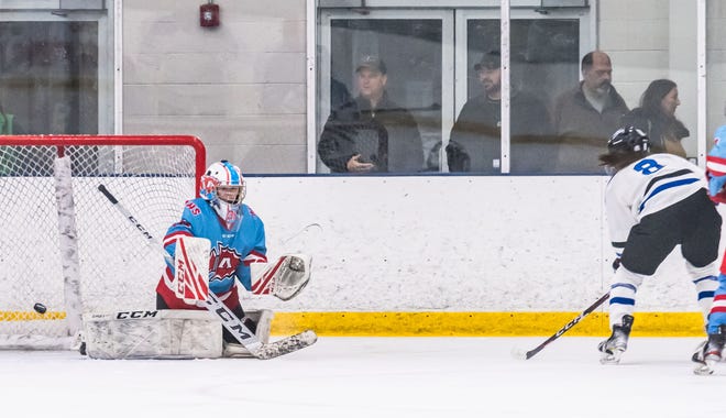 Lakeshore Lightning's Jillian Bilsborough (8) scores on Arrowhead goalie Bri Chmiel (30) at the Ozaukee Ice Center in Mequon on Wednesday, Nov. 29, 2023. The Lightning won 1-0.