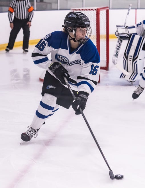 Lakeshore Lightning's Olivia Dykema (16) brings the puck out against Arrowhead at the Ozaukee Ice Center in Mequon on Wednesday, Nov. 29, 2023.