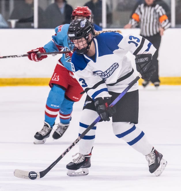 Lakeshore Lightning's Sydney Bertolino (13) collects the puck during the game against Arrowhead at the Ozaukee Ice Center in Mequon on Wednesday, Nov. 29, 2023.