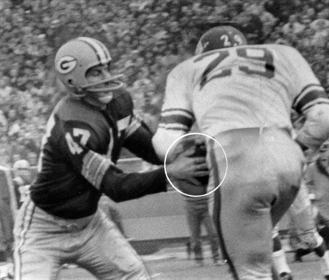 Green Bay cornerback Jesse Whittenton takes the ball from Alex Webster's hands and gives Green Bay possession on New York's 30 yard line during the fourth quarter of their game at County Stadium on Dec 3, 1961.