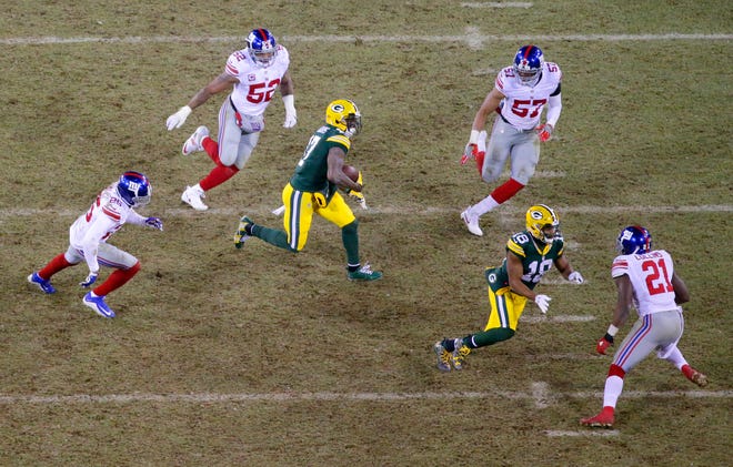 Green Bay Packers wide receiver Davante Adams (17) runs after a catch during the 3rd quarter of the Green Bay Packers wild-card playoff game against the New York Giants at Lambeau Field in Green Bay, Wis. on Sunday, January 8, 2017. The Packers won 38-13.