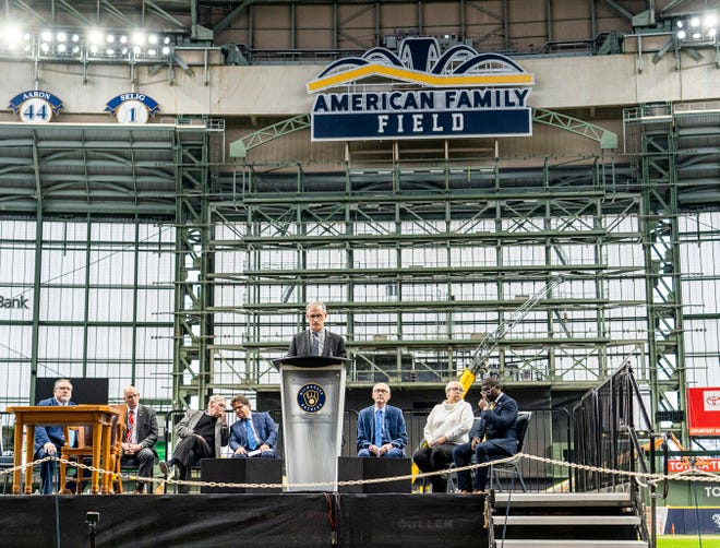 Rick Schlesinger, Milwaukee Brewers president of business operations, speaks as Gov. Tony Evers prepares to sign Assembly Bill 438 and Assembly Bill 439, a bipartisan package of bills passed by the Wisconsin State Legislature to keep the Milwaukee Brewers and Major League Baseball (MLB) in Wisconsin through 2050, on Tuesday December 5, 2023 at American Family Field in Milwaukee, Wis.