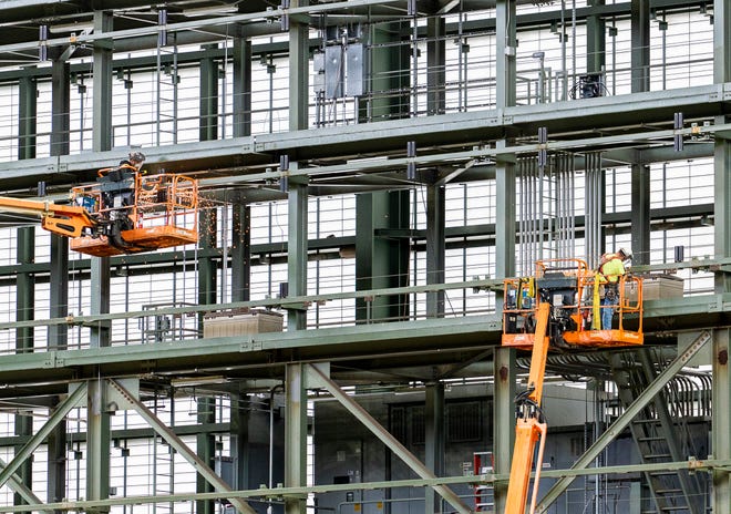 Construction workers are seen taking apart the Brewers scoreboard after Gov. Tony Evers signs Assembly Bill 438 and Assembly Bill 439, a bipartisan package of bills passed by the Wisconsin State Legislature to keep the Milwaukee Brewers and Major League Baseball (MLB) in Wisconsin through 2050, on Tuesday December 5, 2023 at American Family Field in Milwaukee, Wis.