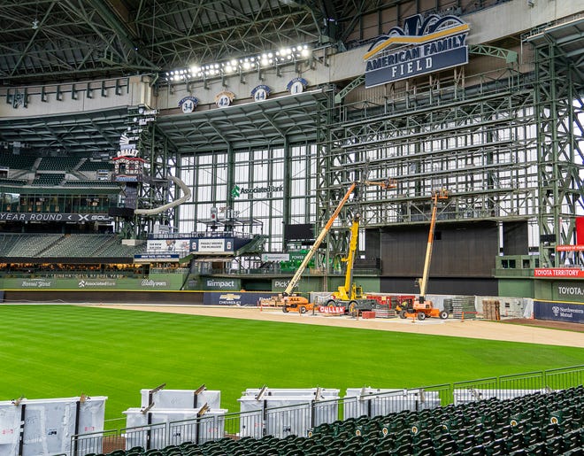 Construction workers are seen taking apart the Brewers scoreboard after Gov. Tony Evers signs Assembly Bill 438 and Assembly Bill 439, a bipartisan package of bills passed by the Wisconsin State Legislature to keep the Milwaukee Brewers and Major League Baseball (MLB) in Wisconsin through 2050, on Tuesday December 5, 2023 at American Family Field in Milwaukee, Wis.